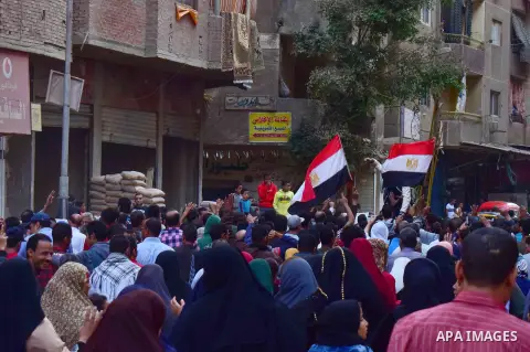 Egyptian supporters of ousted Islamist president Mohammed Morsi and the Muslim Brotherhood, march shouting slogans against the President Abdel Fattah al-Sisi and the military rule in al-Haram neighbourhood in the souther...