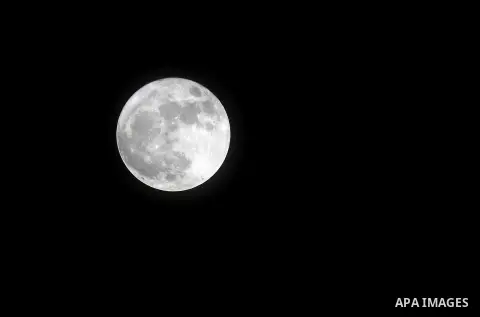 The 'Supermoon' rises over the West Bank city of Hebron on November 14, 2016. The moon will be the closest to Earth since 1948 at a distance of 356,509 kilometres (221,524 miles), creating what NASA described as "an extr...