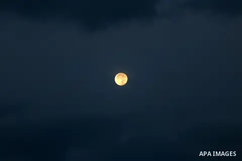 A supermoon is pictured above at dawn in Gaza city, on November 15, 2016. Photo by Mohammed Asad
