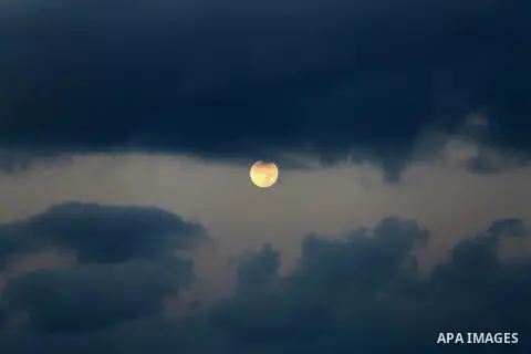 A supermoon is pictured above at dawn in Gaza city, on November 15, 2016. Photo by Mohammed Asad