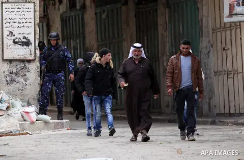 Members of the Palestinian security forces patrol in the West Bank city of Nablus on November 16, 2016. A Palestinian woman was killed and three Palestinian security officers were injured during armed clashes with suspec...