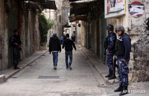 Members of the Palestinian security forces patrol in the West Bank city of Nablus on November 16, 2016. A Palestinian woman was killed and three Palestinian security officers were injured during armed clashes with suspec...