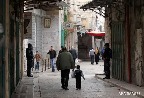 Members of the Palestinian security forces patrol in the West Bank city of Nablus on November 16, 2016. A Palestinian woman was killed and three Palestinian security officers were injured during armed clashes with suspec...