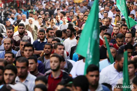 Palestinian Hamas supporters take part during a protest against a controversial Israeli bill to limit the volume of calls to prayer at mosques in the occupied Jerusalem, in Jabalia in the northern Gaza Strip, on Nov. 18,...