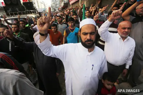 Palestinian Hamas supporters take part during a protest against a controversial Israeli bill to limit the volume of calls to prayer at mosques in the occupied Jerusalem, in Jabalia in the northern Gaza Strip, on Nov. 18,...
