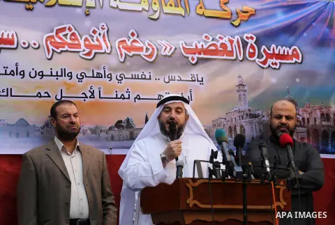 Palestinian Hamas supporters take part during a protest against a controversial Israeli bill to limit the volume of calls to prayer at mosques in the occupied Jerusalem, in Jabalia in the northern Gaza Strip, on Nov. 18,...