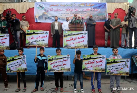 Palestinian Hamas supporters take part during a protest against a controversial Israeli bill to limit the volume of calls to prayer at mosques in the occupied Jerusalem, in Jabalia in the northern Gaza Strip, on Nov. 18,...