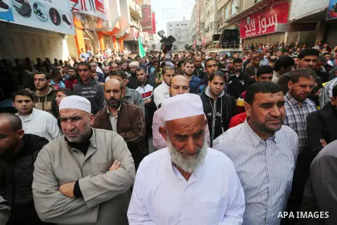 Palestinian Hamas supporters take part during a protest against a controversial Israeli bill to limit the volume of calls to prayer at mosques in the occupied Jerusalem, in Jabalia in the northern Gaza Strip, on Nov. 18,...