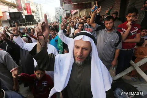 Palestinian Hamas supporters take part during a protest against a controversial Israeli bill to limit the volume of calls to prayer at mosques in the occupied Jerusalem, in Jabalia in the northern Gaza Strip, on Nov. 18,...