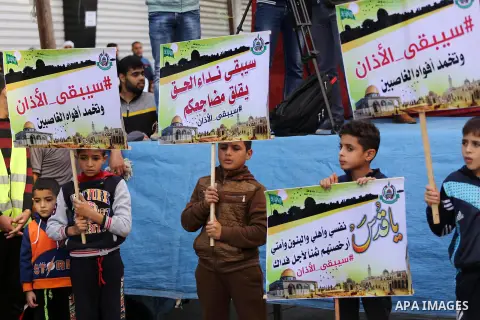 Palestinian Hamas supporters take part during a protest against a controversial Israeli bill to limit the volume of calls to prayer at mosques in the occupied Jerusalem, in Jabalia in the northern Gaza Strip, on Nov. 18,...