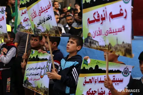 Palestinian Hamas supporters take part during a protest against a controversial Israeli bill to limit the volume of calls to prayer at mosques in the occupied Jerusalem, in Jabalia in the northern Gaza Strip, on Nov. 18,...