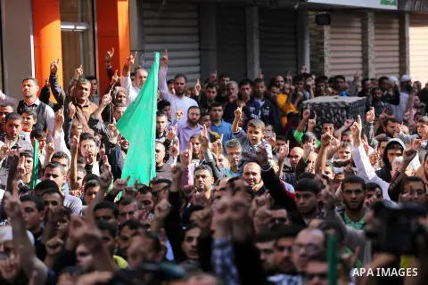 Palestinian Hamas supporters take part during a protest against a controversial Israeli bill to limit the volume of calls to prayer at mosques in the occupied Jerusalem, in Jabalia in the northern Gaza Strip, on Nov. 18,...