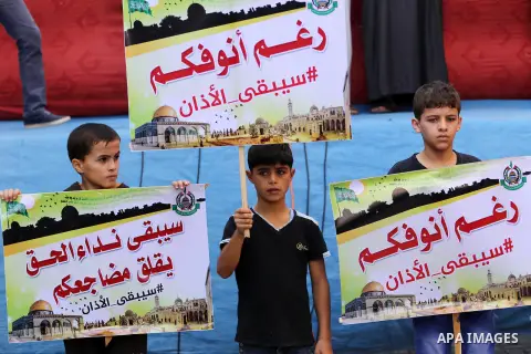Palestinian Hamas supporters take part during a protest against a controversial Israeli bill to limit the volume of calls to prayer at mosques in the occupied Jerusalem, in Jabalia in the northern Gaza Strip, on Nov. 18,...