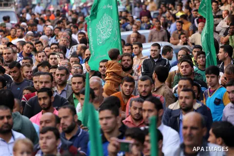 Palestinian Hamas supporters take part during a protest against a controversial Israeli bill to limit the volume of calls to prayer at mosques in the occupied Jerusalem, in Jabalia in the northern Gaza Strip, on Nov. 18,...