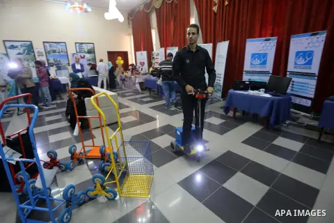 Palestinians take part during technology exhibition funded by Islamic Development Bank in Jeddah, at the Islamic University in Gaza city, on Nov. 20, 2016. Photo by Mohammed Asad
