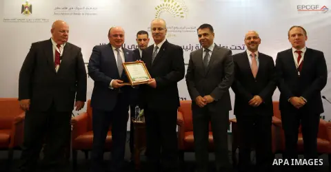 Palestinian Prime Minister, Rami hamdallah, attends the Palestine International Banking Conference, in the West Bank city of Ramallah, on November 21, 2016. Photo by Prime Minister Office