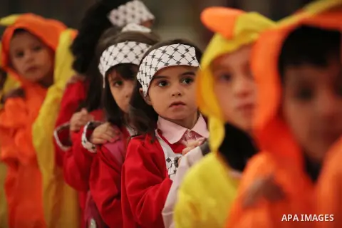 Palestinian children play during an entertaining day to mark the UN Universal Children's Day in Gaza City on November 23, 2016. Photo by Ashraf Amra