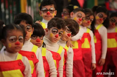 Palestinian children play during an entertaining day to mark the UN Universal Children's Day in Gaza City on November 23, 2016. Photo by Ashraf Amra