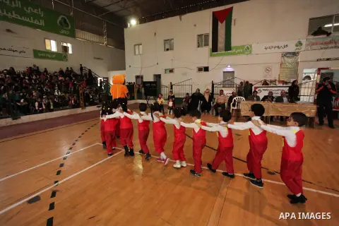 Palestinian children play during an entertaining day to mark the UN Universal Children's Day in Gaza City on November 23, 2016. Photo by Ashraf Amra
