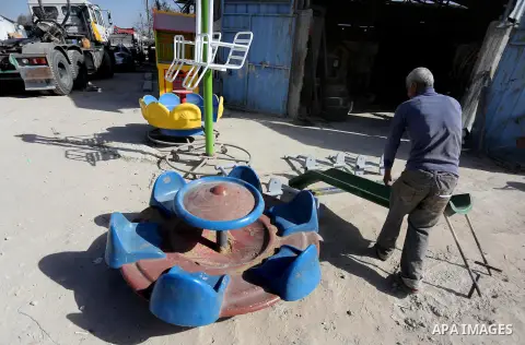 Palestinian men work on the manufacture and maintenance of the swings "amusement games" at al-salam factory in the Zeitoun neighborhood, in Gaza city, on November 26, 2016. Israeli occupation prevented of the introductio...
