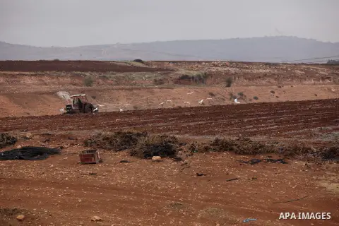 A Palestinian farmer uses a plough in a field in the West Bank village of Nassariya near Nablus November 30, 2016. Photo by Nedal Eshtayah