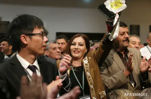 Members of the Fatah party react at the end of a speech delivered by the Palestinian president Mahmoud Abbas on the second day of the 7th Fatah Congress on November 30, 2016, at the Muqataa, the Palestinian Authority hea...