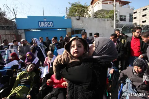 Palestinian girls with disabilities hold banners as they take parts in a rally in Gaza City demanding for the rights of people with disabilities in Gaza on December 5, 2016 Tens of thousands of Gazans are learning to liv...