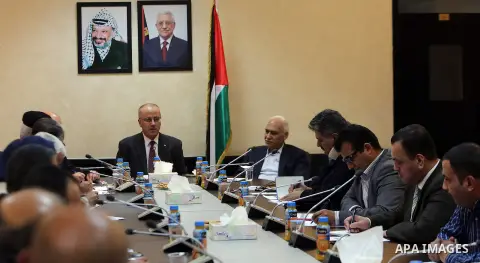 Palestinian Prime Minister, Rami Hamdallah, chairs a meeting of the Supreme Council of Civil Defence, in the Wet Bank city of Ramallah, on December 5, 2016. Photo by Prime Minister Office