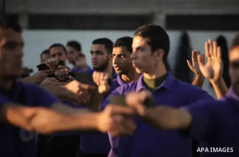 Palestinian applicants for a private security guard job at Castle Security company undergo a physical examination in an open-air playground in Gaza City on December 08, 2016. Photo by Ashraf Amra