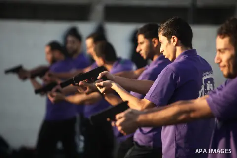 Palestinian applicants for a private security guard job at Castle Security company undergo a physical examination in an open-air playground in Gaza City on December 08, 2016. Photo by Ashraf Amra