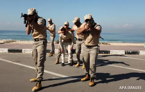 Palestinian private security guards from Castle Security company take part in an exercise during a simulation on how to secure important characters, in Gaza City on December 08, 2016. Photo by Ashraf Amra