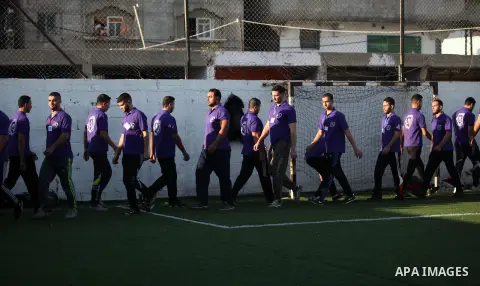 Palestinian applicants for a private security guard job at Castle Security company undergo a physical examination in an open-air playground in Gaza City on December 08, 2016. Photo by Ashraf Amra