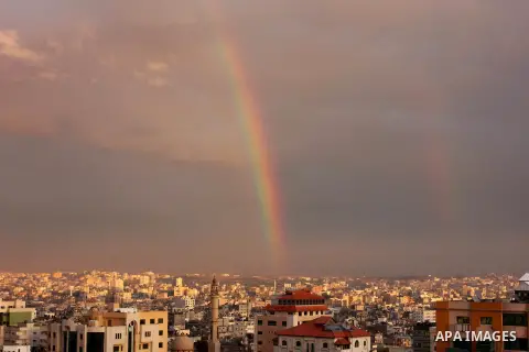A rainbow appears over Gaza city after rain during the sunset on December 08, 2016. Photo by Stranger
