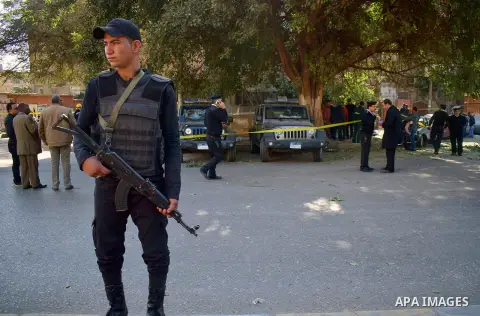 Egyptian special police officers stand guard at the scene of a bomb blast in Giza Al Haram Street on the outskirts of Cairo, Egypt December 9, 2016. Photo by Amr Sayed
