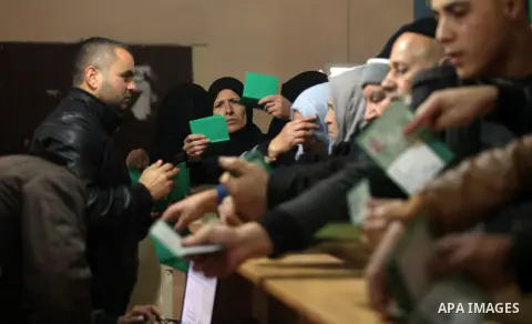 Palestinians wait for travel permits to cross into Egypt through the Rafah border crossing after it was opened by Egyptian authorities for humanitarian cases, in Rafah in the southern Gaza Strip December 10, 2016. An off...