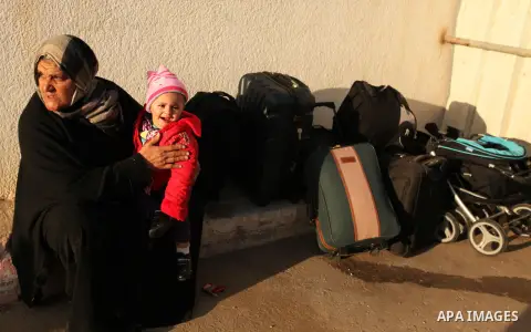 Palestinians wait for travel permits to cross into Egypt through the Rafah border crossing after it was opened by Egyptian authorities for humanitarian cases, in Rafah in the southern Gaza Strip December 10, 2016. An off...