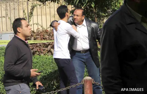 A relative of one of the blast victims reacts at the scene of a bomb explosion at the Saint Peter and Saint Paul Coptic Orthodox Church on December 11, 2016, in Cairo's Abbasiya neighbourhood. The blast killed at least 2...