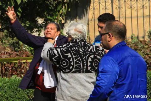 A relative of one of the blast victims reacts at the scene of a bomb explosion at the Saint Peter and Saint Paul Coptic Orthodox Church on December 11, 2016, in Cairo's Abbasiya neighbourhood. The blast killed at least 2...