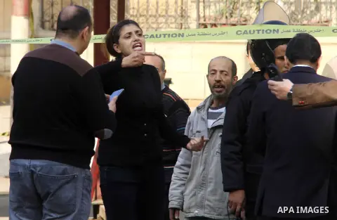 A relative of one of the blast victims reacts at the scene of a bomb explosion at the Saint Peter and Saint Paul Coptic Orthodox Church on December 11, 2016, in Cairo's Abbasiya neighbourhood. The blast killed at least 2...