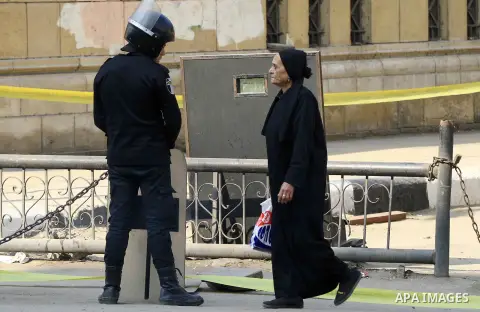 A relative of one of the blast victims reacts at the scene of a bomb explosion at the Saint Peter and Saint Paul Coptic Orthodox Church on December 11, 2016, in Cairo's Abbasiya neighbourhood. The blast killed at least 2...