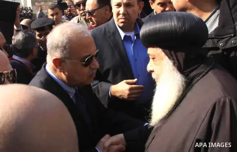 Egyptian Prime Minister Sherif Ismail checks the damaged Saint Peter and Saint Paul Coptic Orthodox Church after a bombing on December 11, 2016, in Cairo's Abbasiya neighbourhood. The blast killed at least 25 worshippers...