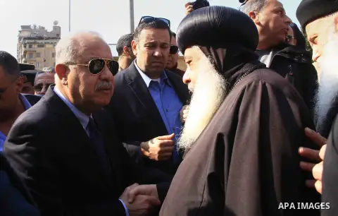 Egyptian Prime Minister Sherif Ismail checks the damaged Saint Peter and Saint Paul Coptic Orthodox Church after a bombing on December 11, 2016, in Cairo's Abbasiya neighbourhood. The blast killed at least 25 worshippers...