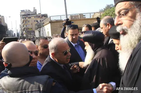 Egyptian Prime Minister Sherif Ismail checks the damaged Saint Peter and Saint Paul Coptic Orthodox Church after a bombing on December 11, 2016, in Cairo's Abbasiya neighbourhood. The blast killed at least 25 worshippers...