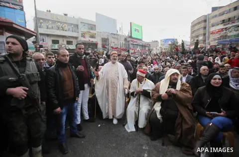Palestinians Muslim Sufis attend a ceremony commemorating the birth of Prophet Mohammed, known in Arabic as "Mawlid al-Nabawi", in the West Bank city of Nablus on December 11, 2016. Photo by Nedal Eshtayah