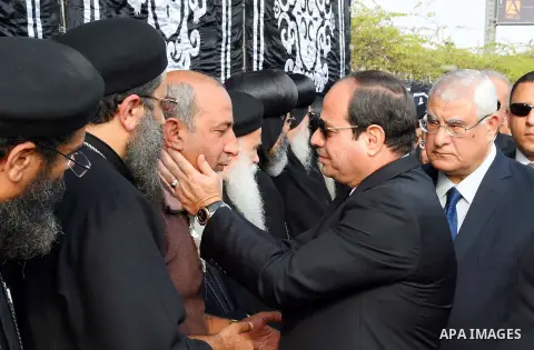Egyptian President Abdel Fattah al-Sisi attends the funeral of the victims of a bomb explosion that targeted a Coptic Orthodox Church in Cairo, on December 12, 2016. Photo by Egyptian President Office