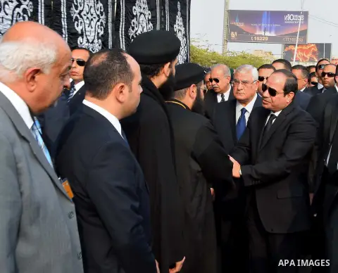 Egyptian President Abdel Fattah al-Sisi attends the funeral of the victims of a bomb explosion that targeted a Coptic Orthodox Church in Cairo, on December 12, 2016. Photo by Egyptian President Office
