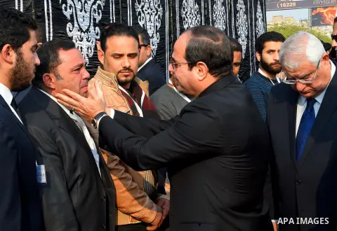 Egyptian President Abdel Fattah al-Sisi attends the funeral of the victims of a bomb explosion that targeted a Coptic Orthodox Church in Cairo, on December 12, 2016. Photo by Egyptian President Office