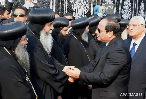 Egyptian President Abdel Fattah al-Sisi attends the funeral of the victims of a bomb explosion that targeted a Coptic Orthodox Church in Cairo, on December 12, 2016. Photo by Egyptian President Office