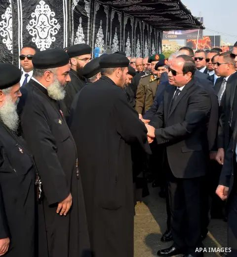 Egyptian President Abdel Fattah al-Sisi attends the funeral of the victims of a bomb explosion that targeted a Coptic Orthodox Church in Cairo, on December 12, 2016. Photo by Egyptian President Office