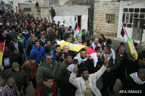 Mourners carry the body of Palestinian Sara Tarayra Hjoj, who according to the Israeli military was shot dead by Israeli police after she tried to stab one of them last July, after Israel released her body, in the West B...